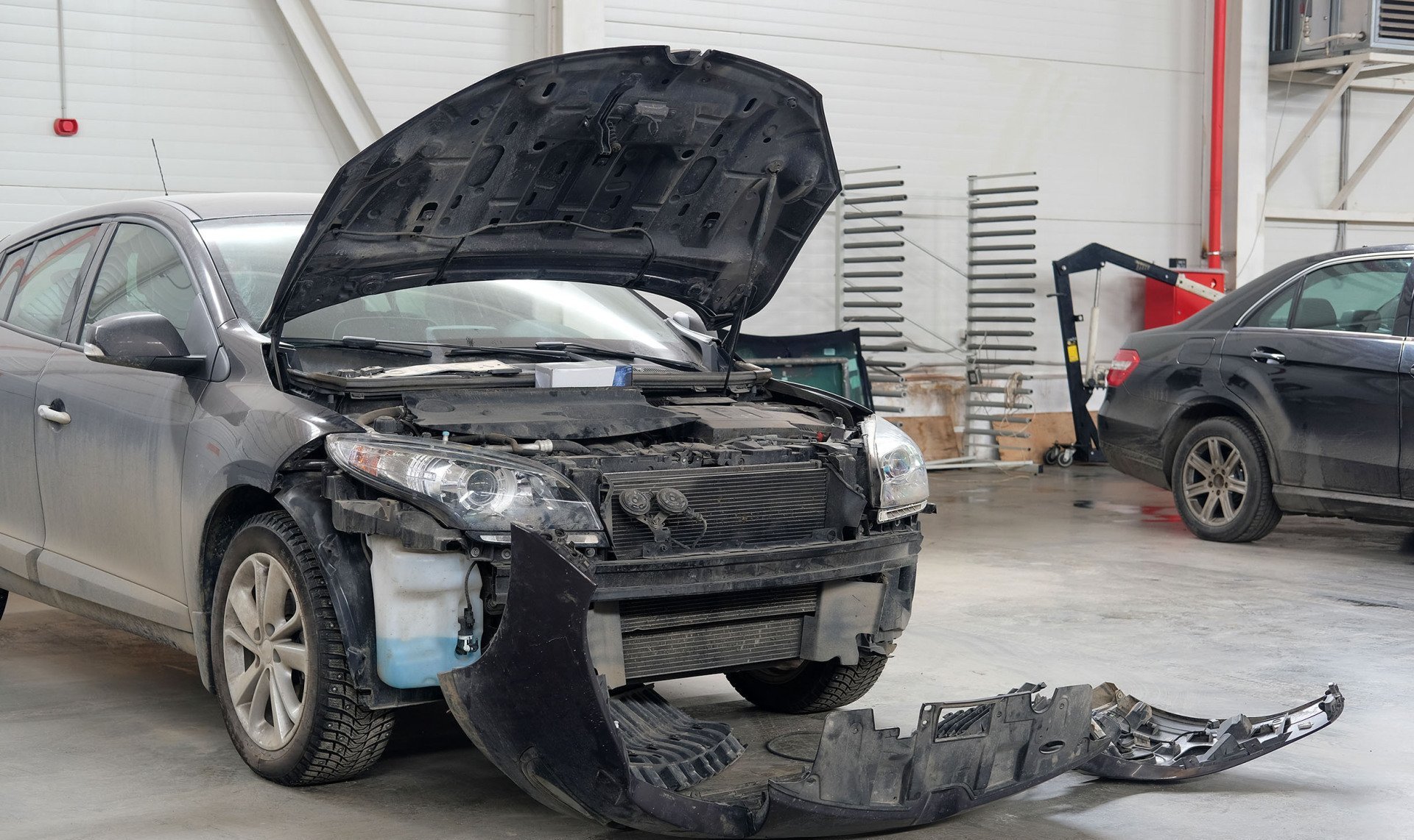 A vehicle undergoing front-end body repairs